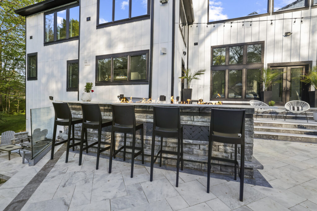 OutdoorBars01_floresLLC - Flores Landscapes Beautiful outdoor bar with high-top chairs on a paver patio in Central Ohio