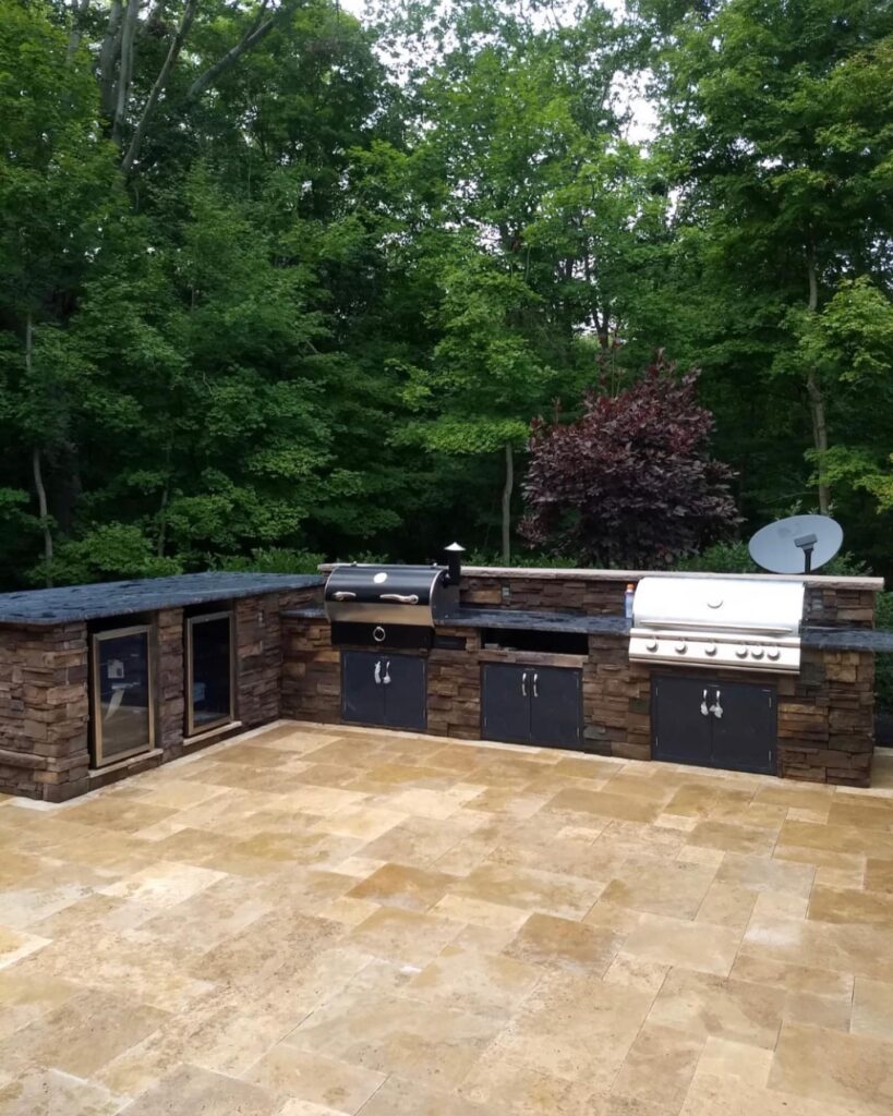 OutdoorKitchen14_floresLLC - Flores Landscapes Modern outdoor kitchen with grill, sink and black countertops in Central Ohio