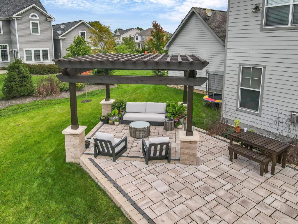 Flores Outdoor Living Space #19 - Flores Landscapes Transforming on outdoor living space with a paver patio, pergola, and seating area in Central Ohio