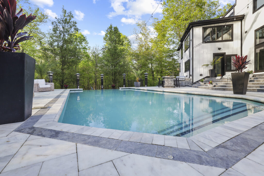 Flores Custom Built Pools #3 - Flores Landscapes Beautiful Central Ohio backyard with custom built pool and stone paver patio