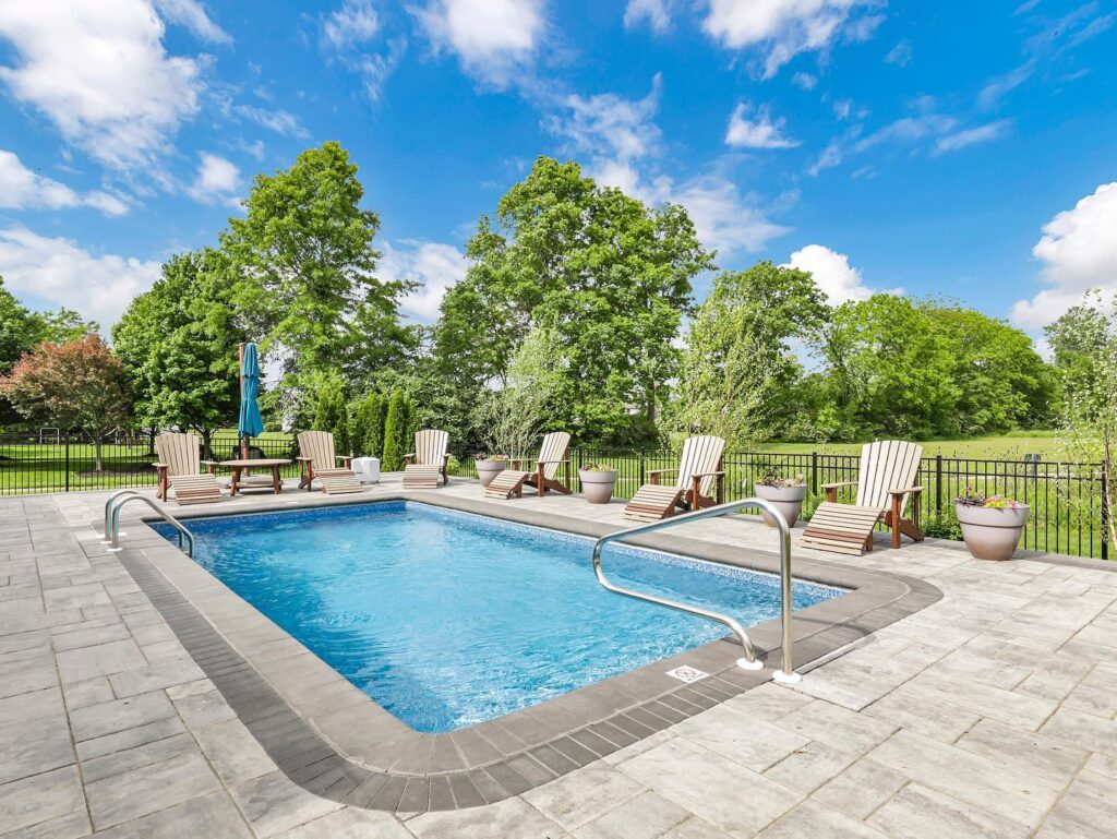 Flores Custom Built Pools #8 - Flores Landscapes Backyard pool retreat perfect for relaxation and entertaining in Central Ohio