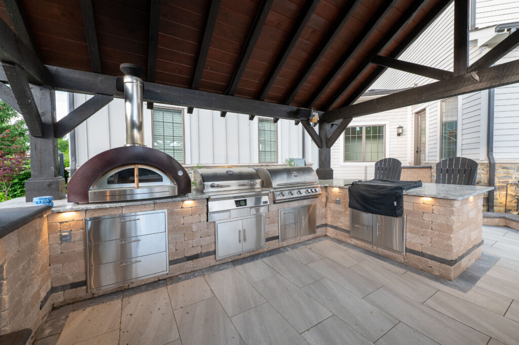 FloresLandscapesMalinowskiOutdoorLivingArea_5-15-25-6 - Flores Landscapes Outdoor kitchen with stainless steel appliances and custom pergola in Central Ohio