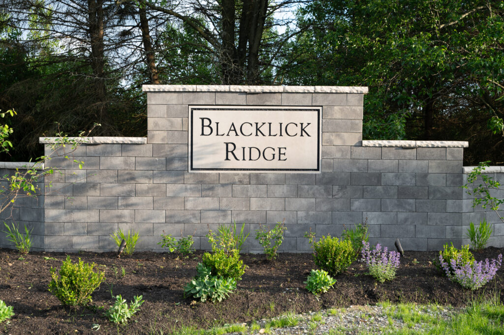 FloresLandscapingBlacklickHoaWall-2 - Flores Landscapes Custom stone wall with mulching and greenery in Central Ohio