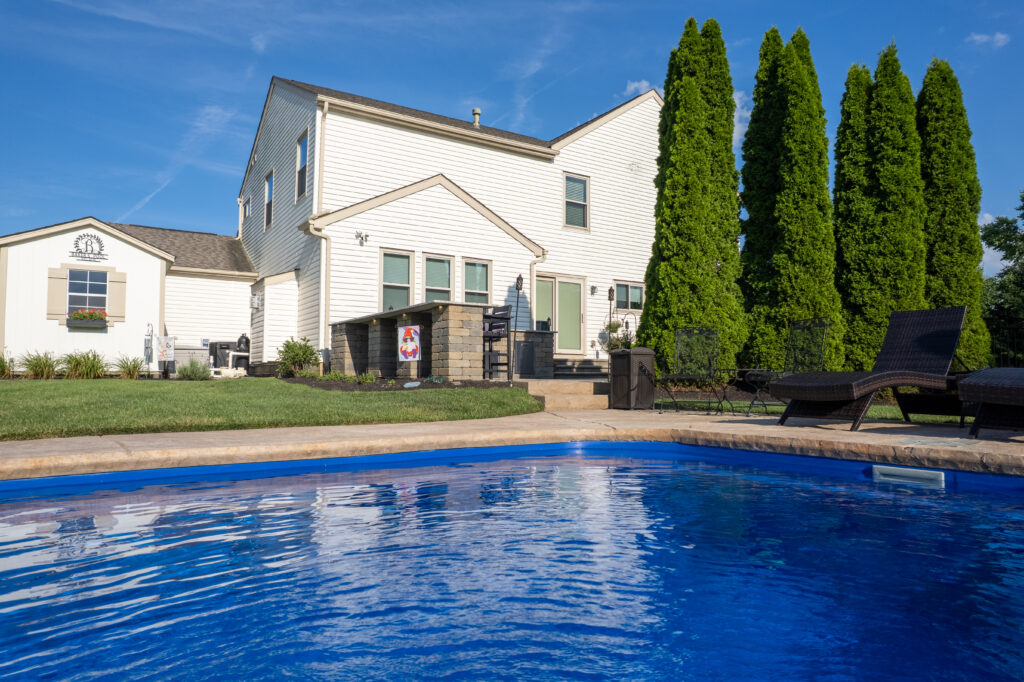 FloresLandscapingBrentBakerOutdoorKitchen-29 - Flores Landscapes Custom sunk-in outdoor pool with paver patio and outdoor kitchen